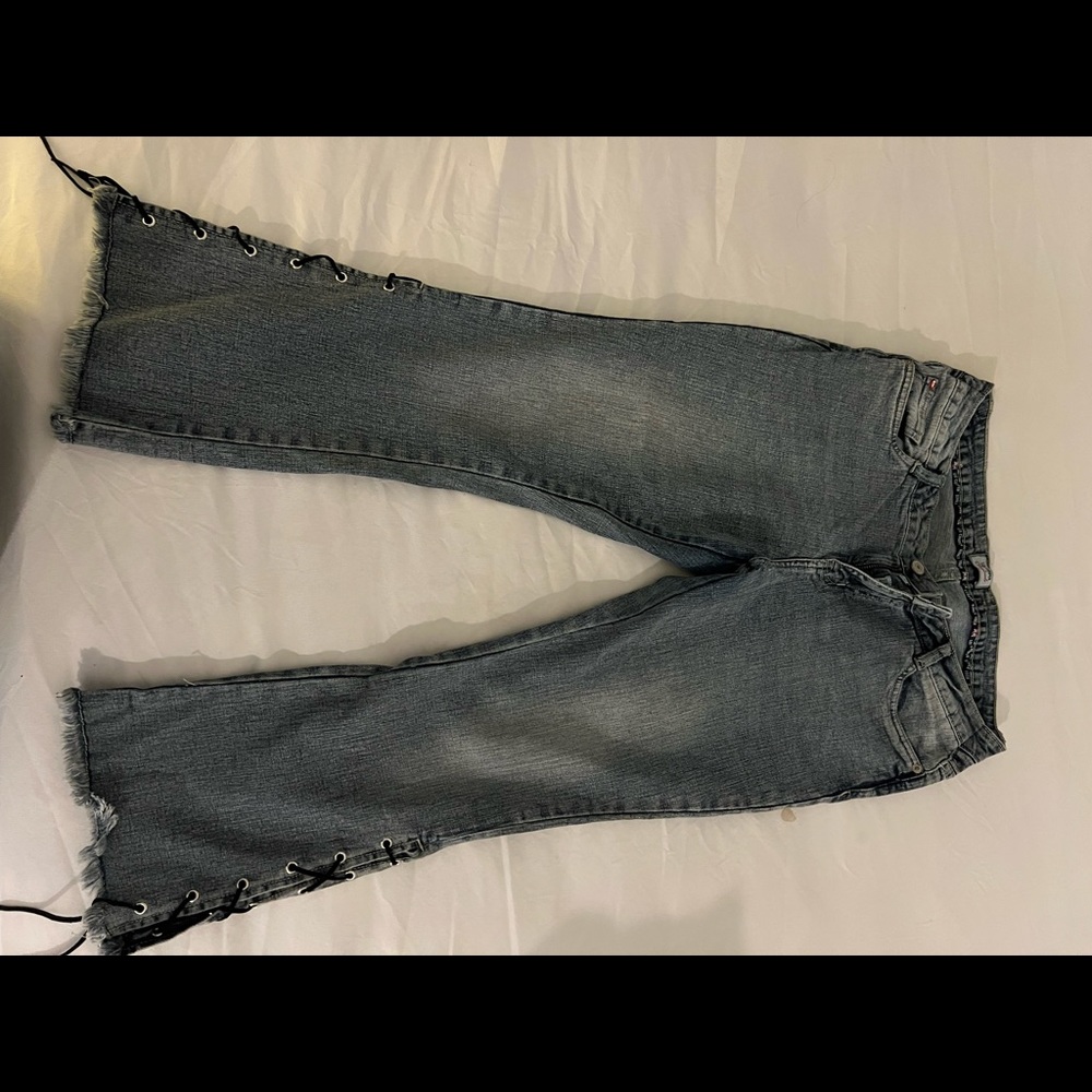 Blue grey flare jeans with tie knots on side